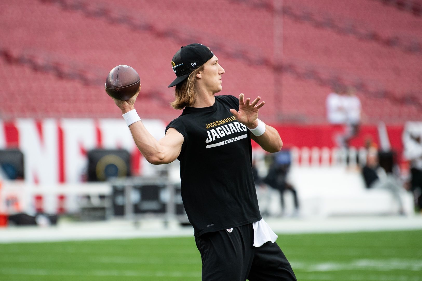 Jacksonville Jaguars quarterback Trevor Lawrence (16) warms up before the game against the Tampa Bay Buccaneers at Raymond James Stadium.