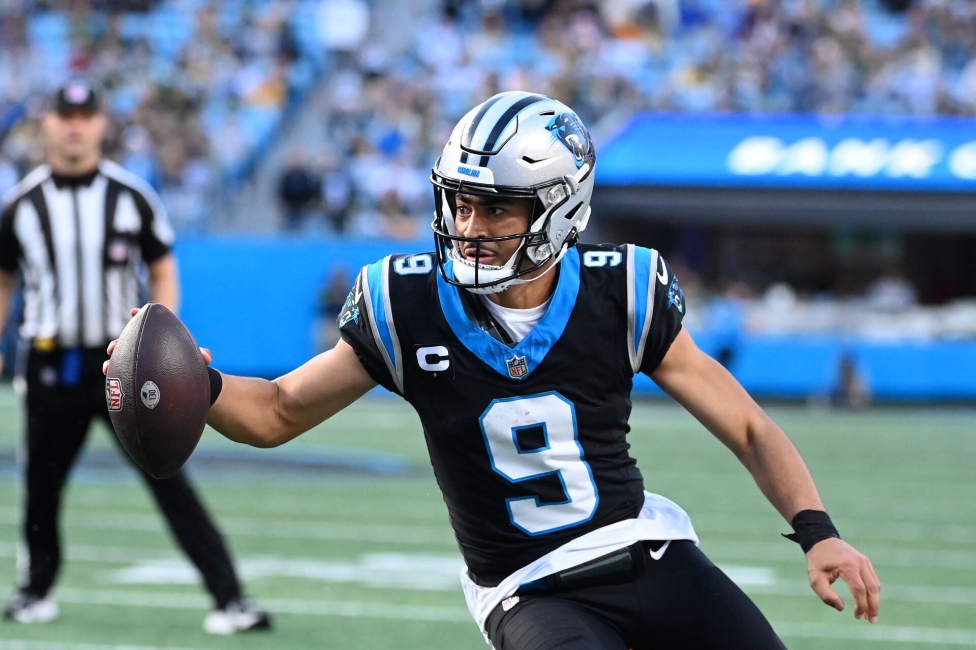 Carolina Panthers quarterback Bryce Young (9) scrambles in the fourth quarter at Bank of America Stadium.