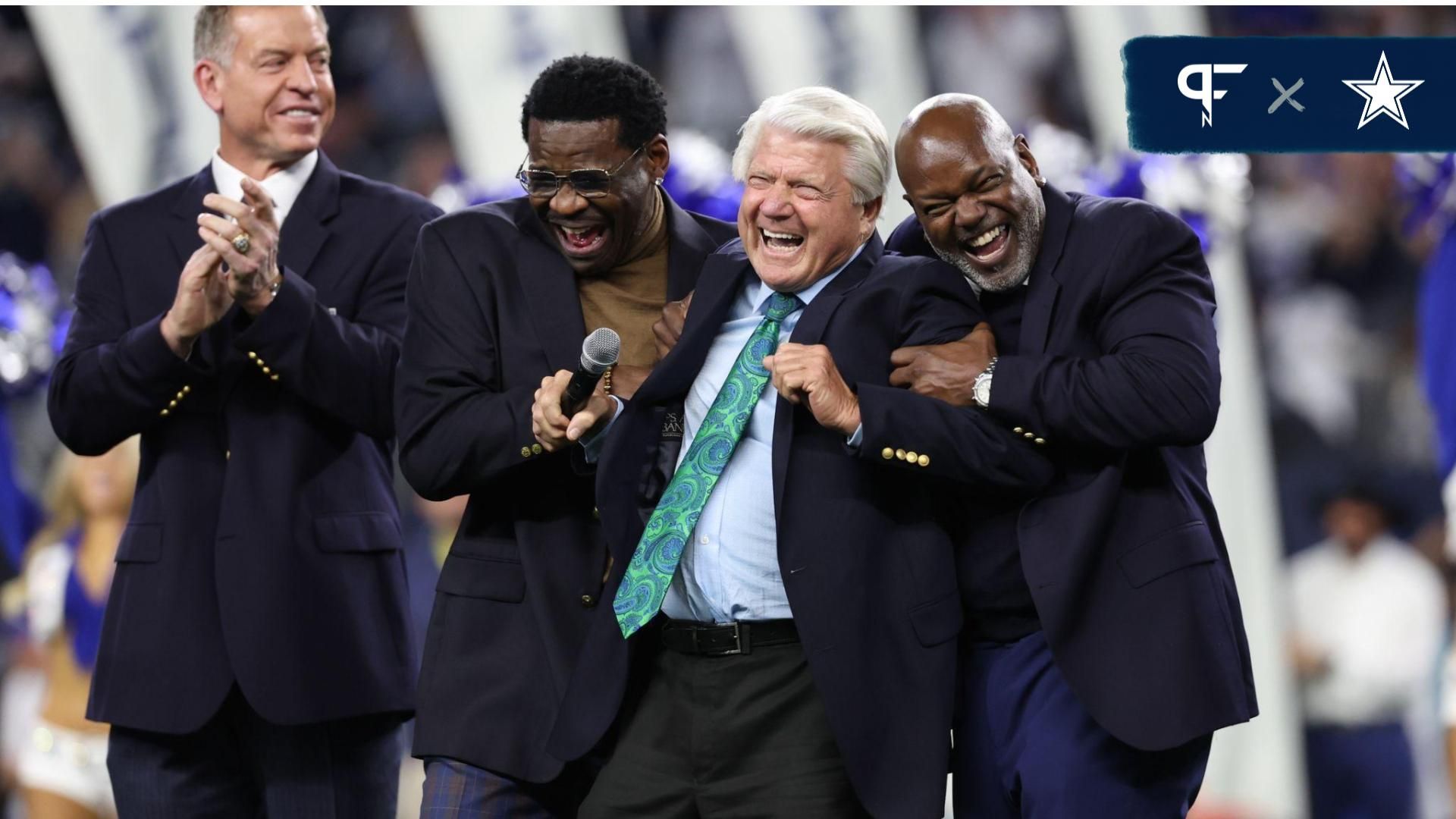 Dallas Cowboys former head coach Jimmy Johnson laughs with former players Troy Aikman and Michael Irvin and Emmitt Smith after being inducted into the ring of honor at halftime of the game against the Detroit Lions at AT&T Stadium.