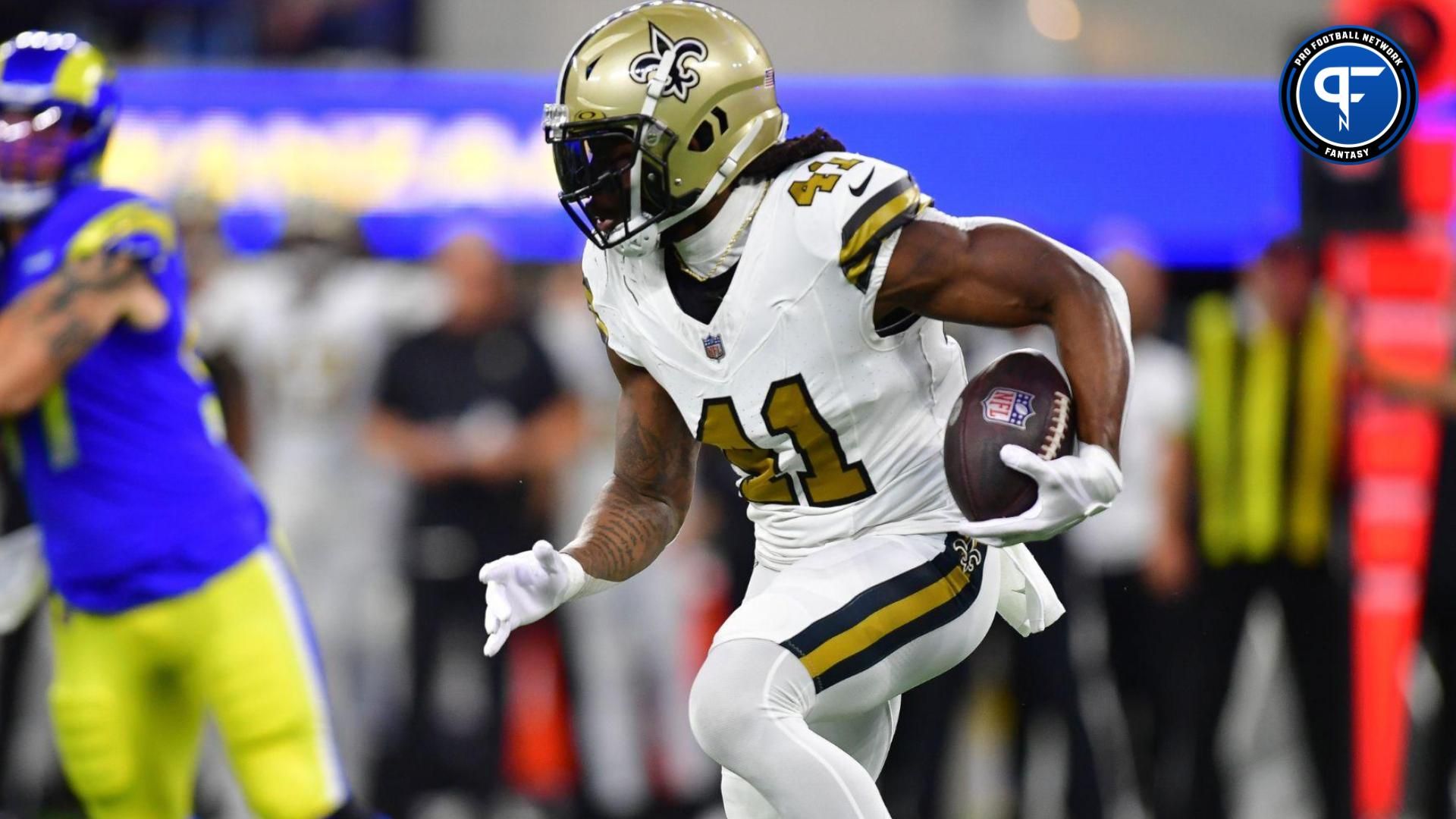 New Orleans Saints running back Alvin Kamara (41) runs the ball against the Los Angeles Rams during the first half at SoFi Stadium.