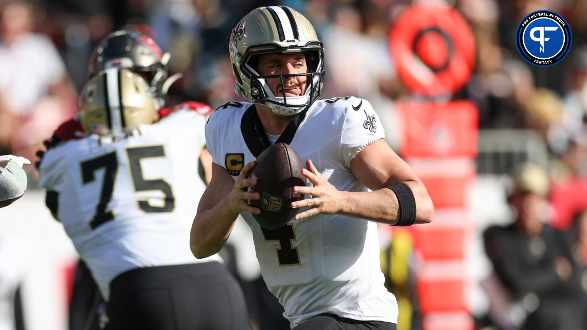 New Orleans Saints quarterback Derek Carr (4) drops back to pass against the Tampa Bay Buccaneers in the third quarter at Raymond James Stadium.