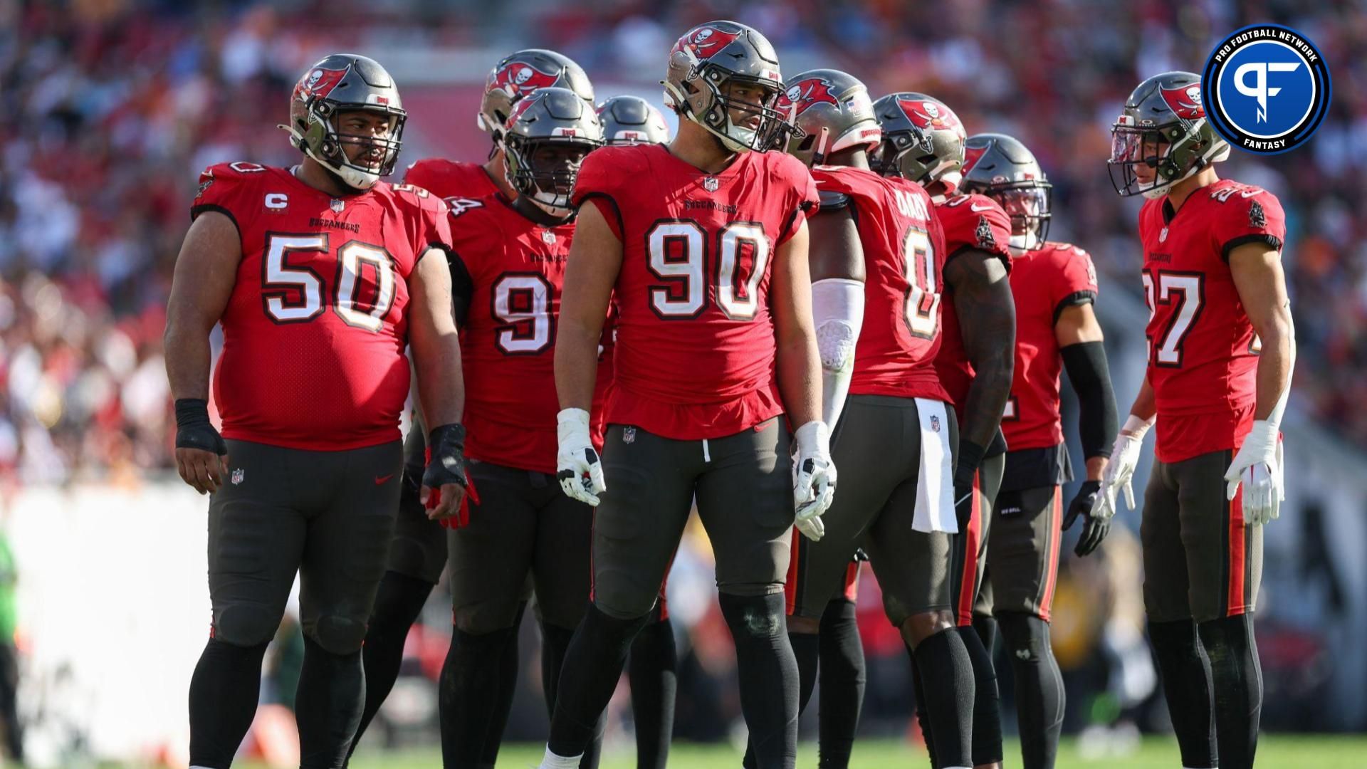 Tampa Bay Buccaneers defensive tackle Vita Vea (50) defensive end Logan Hall (90) and cornerback Zyon McCollum (27) line up against the New Orleans Saints in the third quarter at Raymond James Stadium.