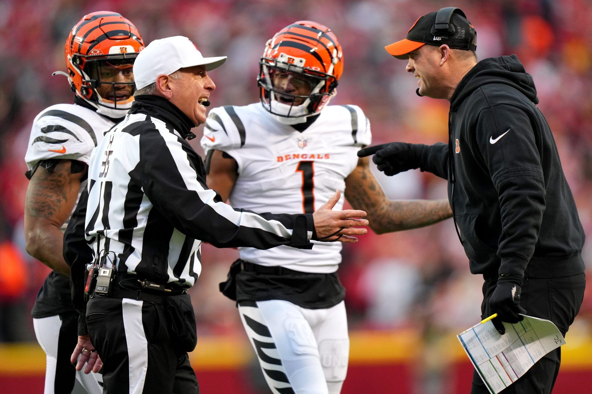 Referee John Hussey (35) talks with Cincinnati Bengals head coach Zac Taylor following an on-field altercation in the second quarter during a Week 17 NFL football game between the Cincinnati Bengals and the Kansas City Chiefs, Sunday, Dec. 31, 2023, at GEHA Field at Arrowhead Stadium in Kansas City, Mo.