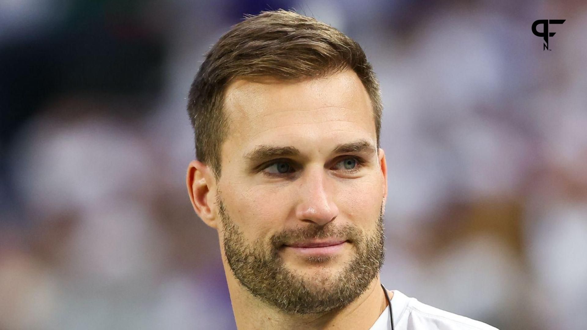 Minnesota Vikings quarterback Kirk Cousins (8) looks on from the bench during the second quarter against the Detroit Lions at U.S. Bank Stadium.