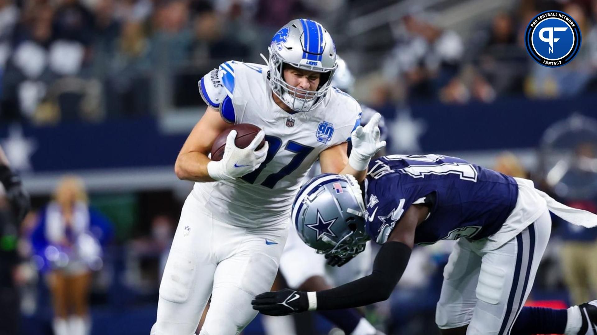 Detroit Lions tight end Sam LaPorta (87) makes a catch as Dallas Cowboys safety Markquese Bell (14) defends during the second half at AT&T Stadium.