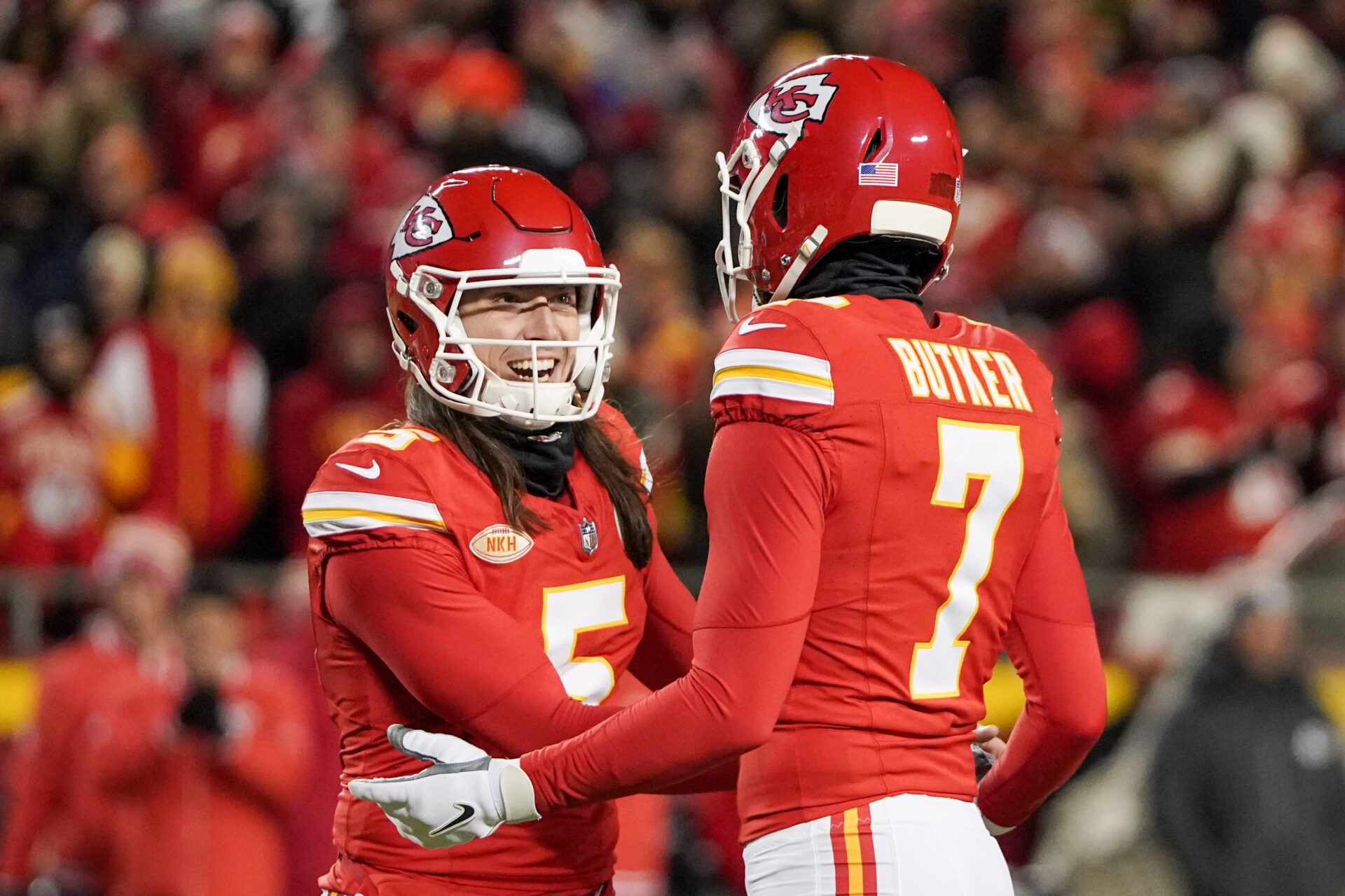 Kansas City Chiefs place kicker Harrison Butker (7) celebrates with holder Tommy Townsend (5) after kicking a field goal against the Cincinnati Bengals during the second half at GEHA Field at Arrowhead Stadium.