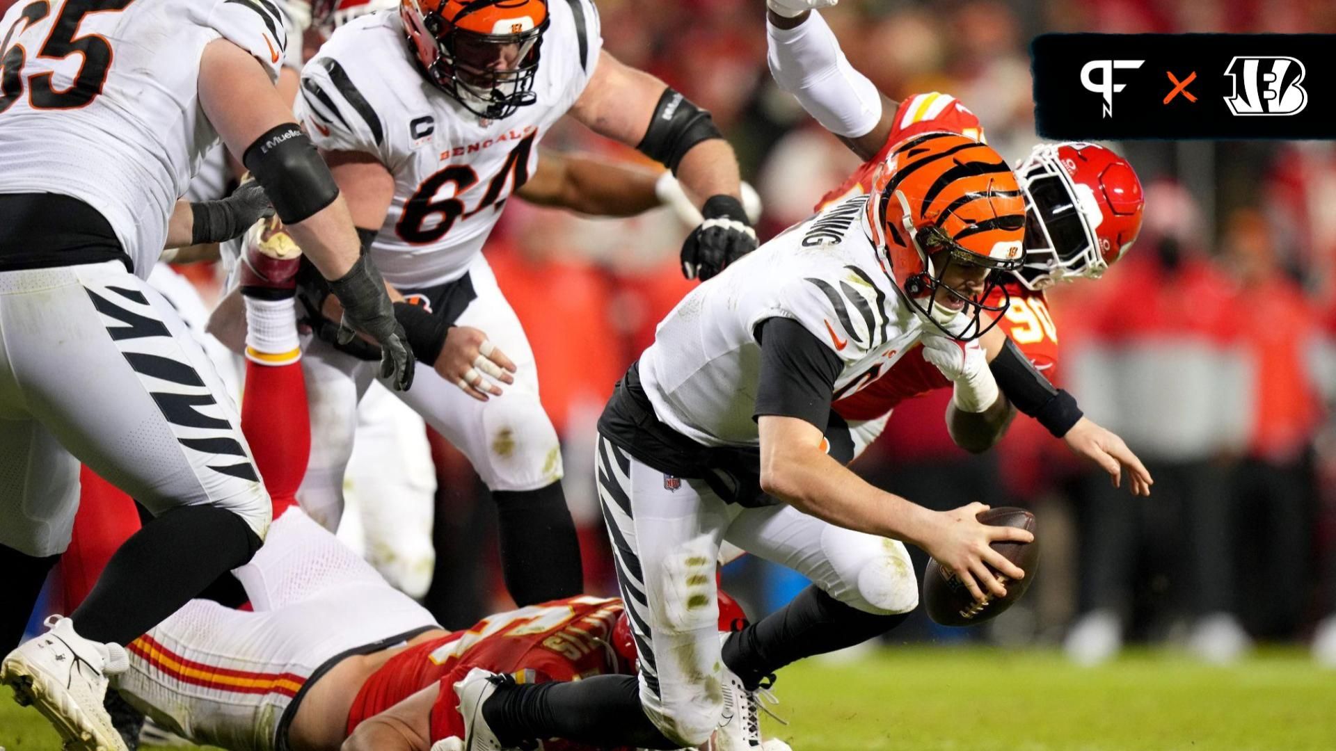 Cincinnati Bengals quarterback Jake Browning (6) is sacked by Kansas City Chiefs defensive end Charles Omenihu (90) in the fourth quarter during a Week 17 NFL football game between the Cincinnati Bengals and the Kansas City Chiefs.