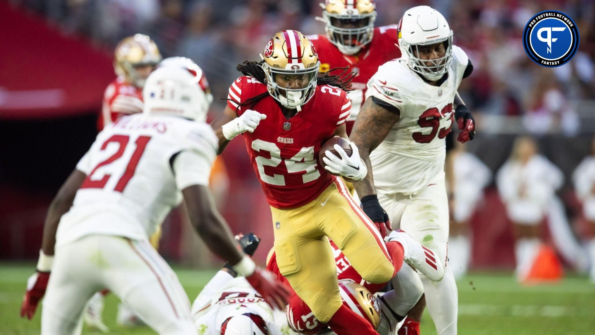 San Francisco 49ers RB Jordan Mason (24) runs the ball against the Arizona Cardinals.