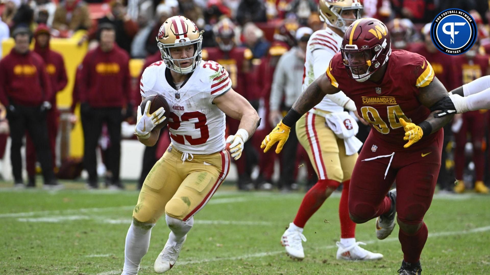 San Francisco 49ers running back Christian McCaffrey (23) carries the ball as Washington Commanders defensive tackle Daron Payne (94) during the second half at FedExField.