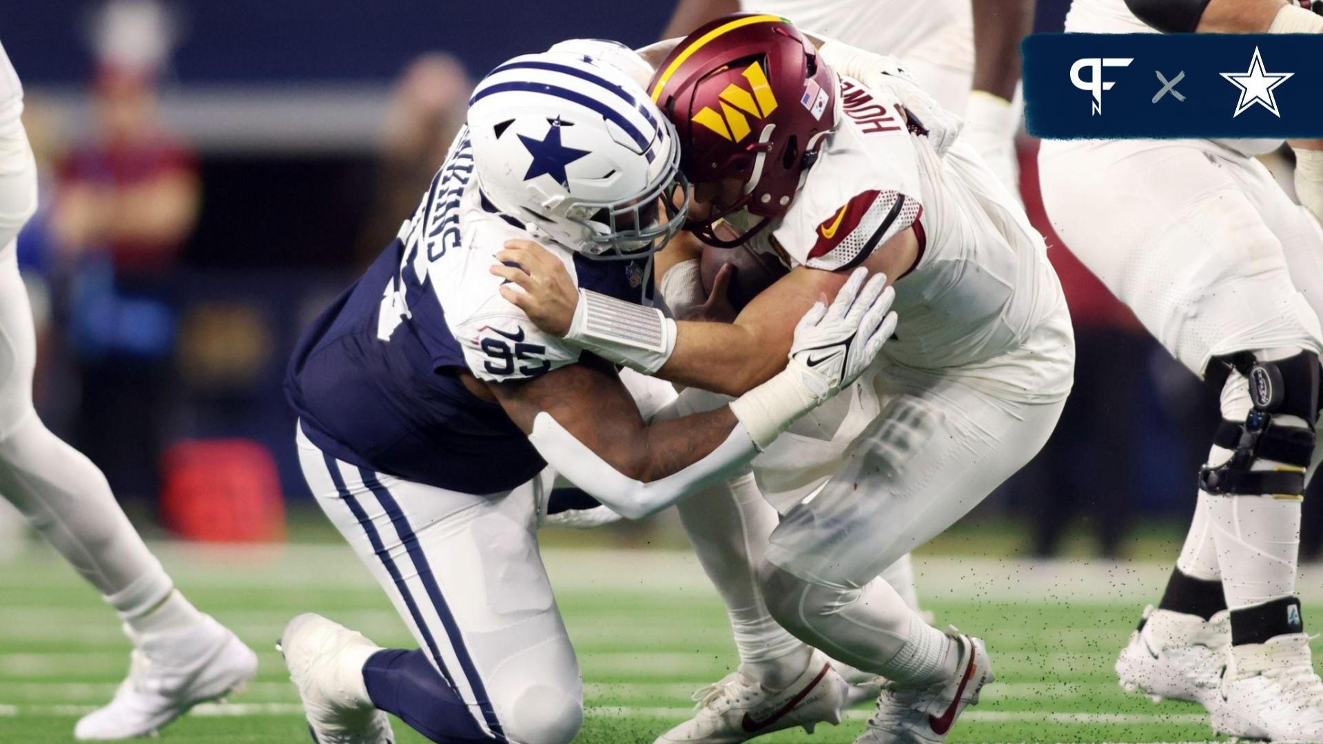 Dallas Cowboys defensive tackle Johnathan Hankins (95) sacks Washington Commanders quarterback Sam Howell (14) in the fourth quarter at AT&T Stadium.