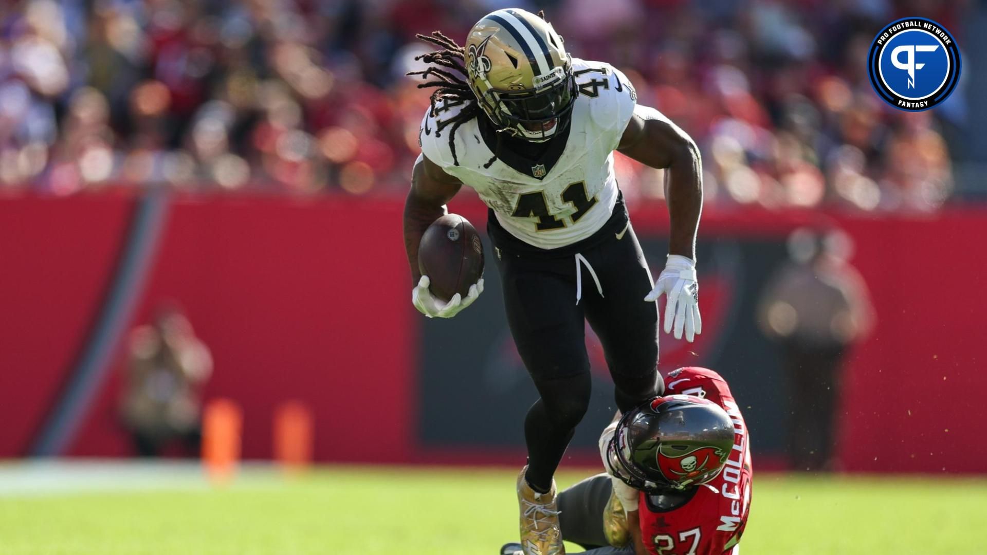 New Orleans Saints running back Alvin Kamara (41) is brought down by Tampa Bay Buccaneers cornerback Zyon McCollum (27) in the second quarter at Raymond James Stadium.