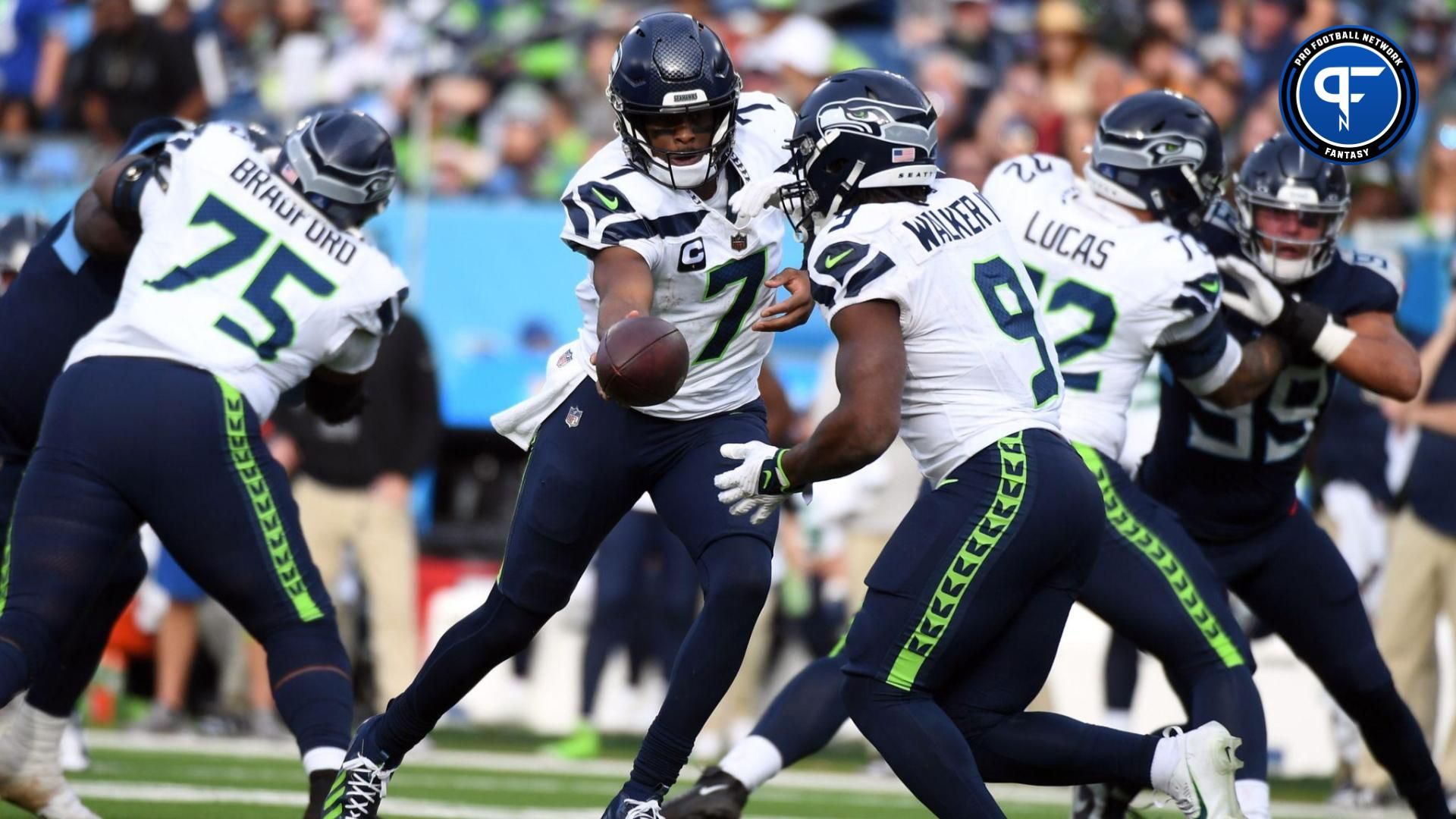 Seattle Seahawks quarterback Geno Smith (7) hands the ball off to running back Kenneth Walker III (9) during the second half against the Tennessee Titans at Nissan Stadium.