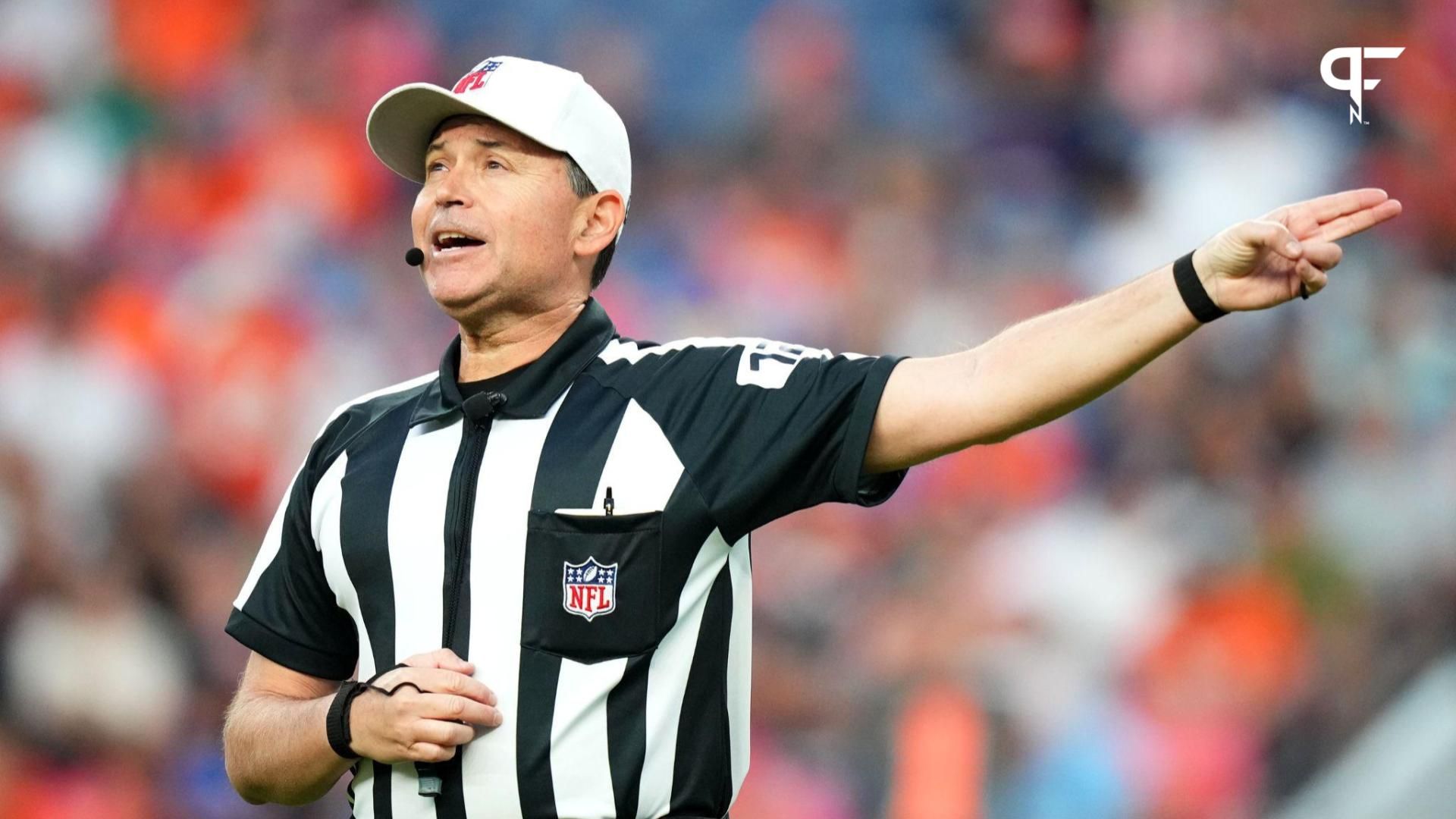 NFL referee Brad Allen (122) calls a personal foul penalty against the Los Angeles Rams during the first quarter at Empower Field at Mile High.