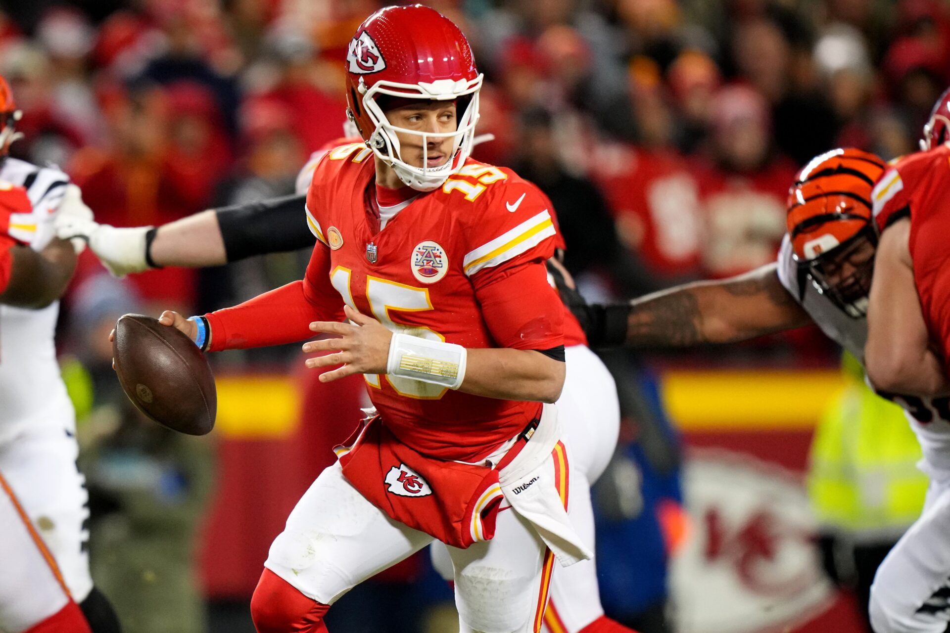 Kansas City Chiefs quarterback Patrick Mahomes (15) roll out of the pocket in the third quarter during a Week 17 NFL football game between the Cincinnati Bengals and the Kansas City Chiefs.