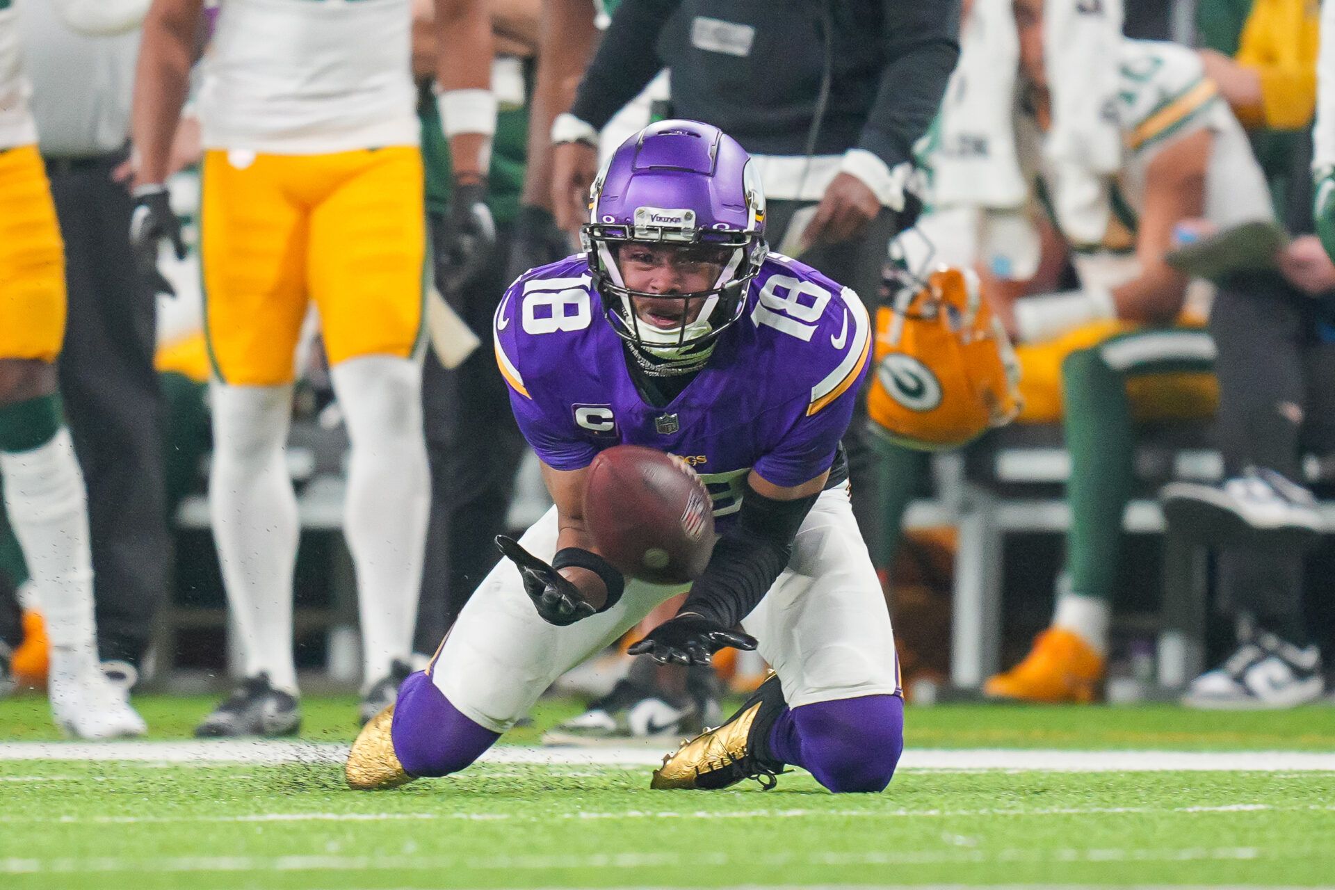 Minnesota Vikings wide receiver Justin Jefferson (18) catches a pass against the Green Bay Packers in the second quarter at U.S. Bank Stadium.