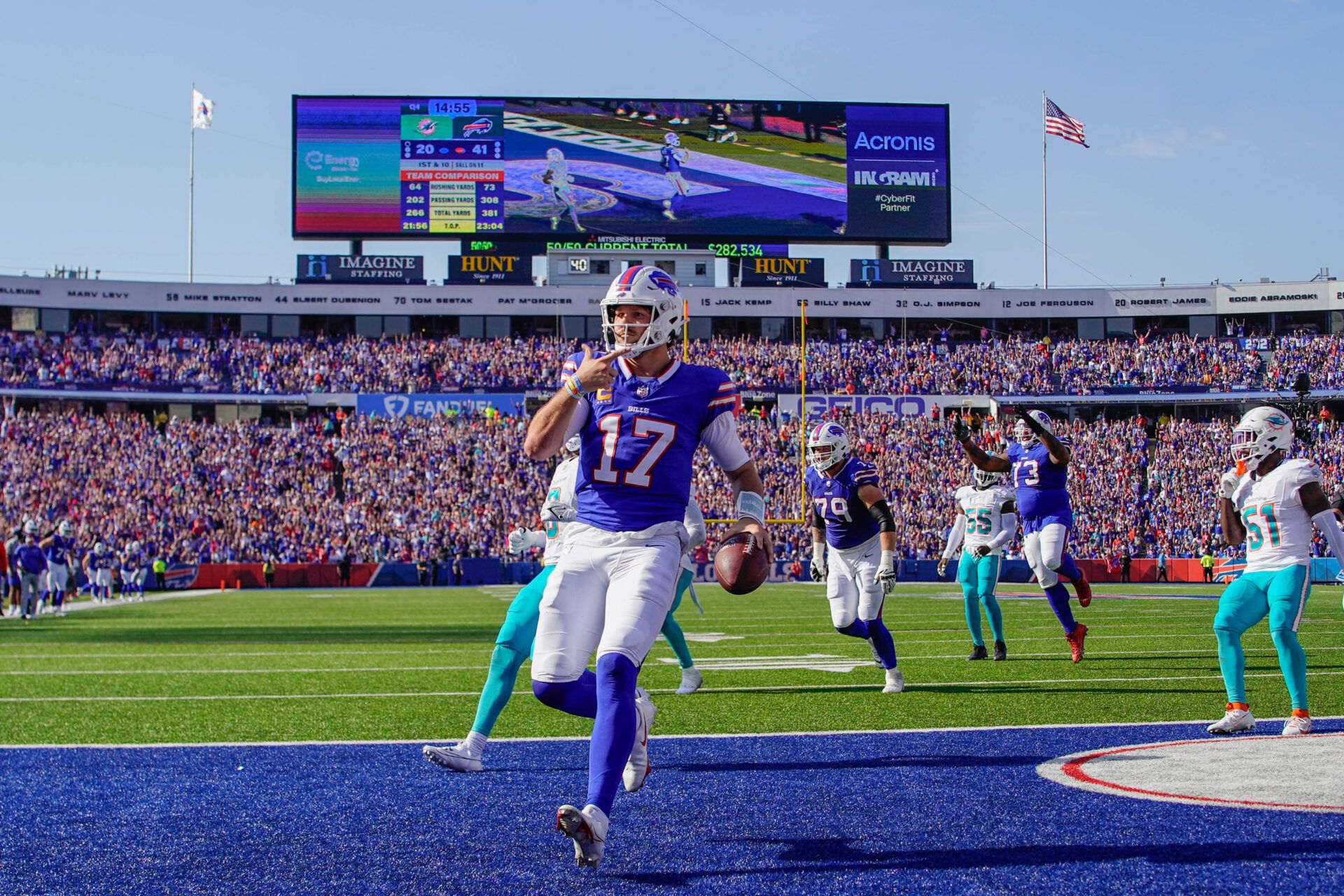 Buffalo Bills quarterback Josh Allen (17) runs with the ball for a touchdown against the Miami Dolphins during the second half at Highmark Stadium.