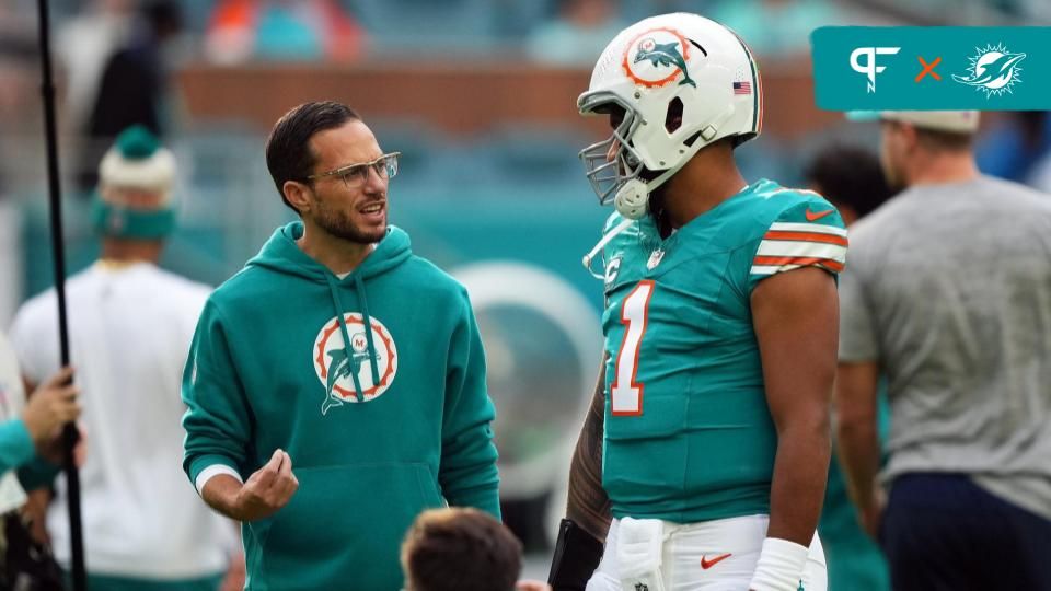 Miami Dolphins head coach Mike McDaniel talks with quarterback Tua Tagovailoa (1) prior to the game against the Dallas Cowboys at Hard Rock Stadium.