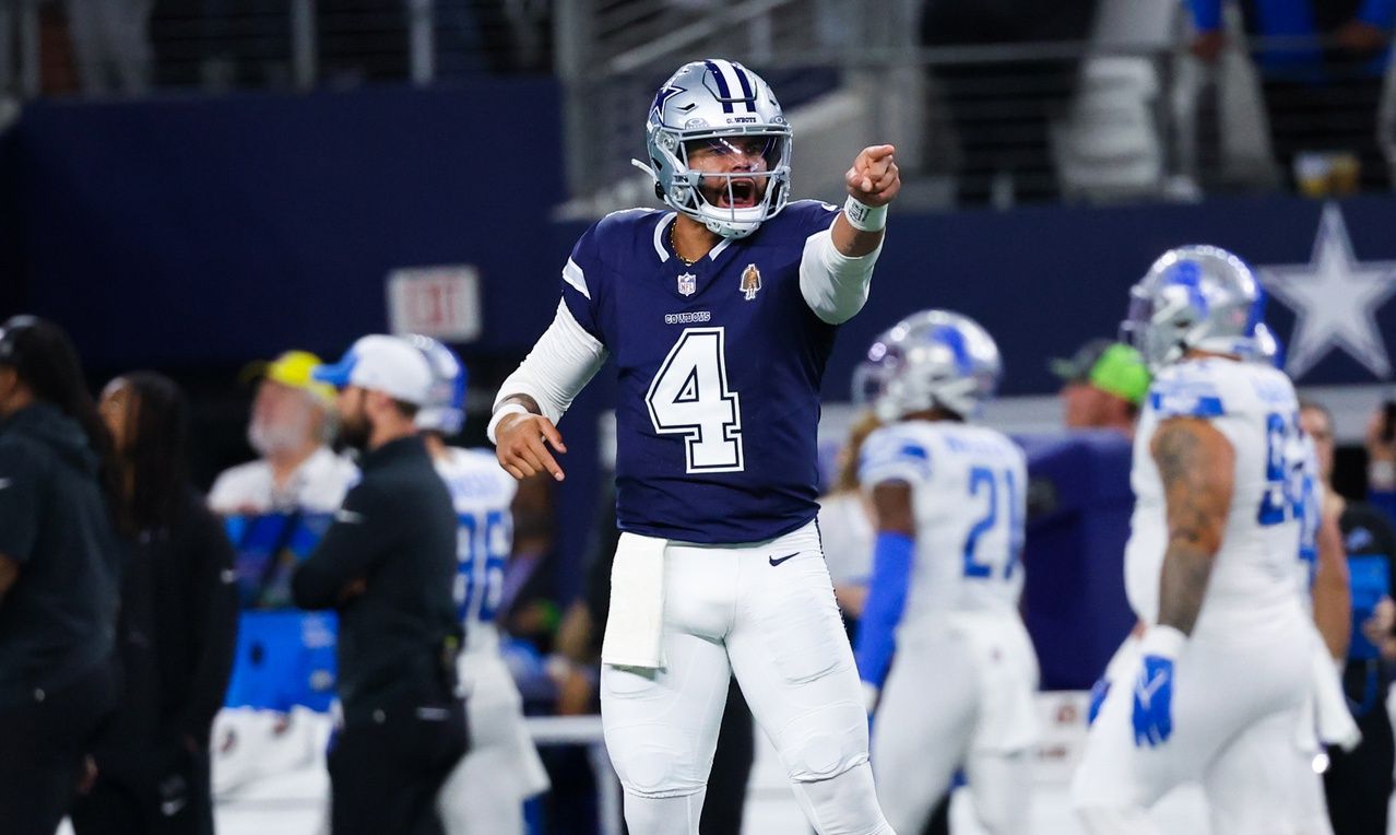 Dallas Cowboys quarterback Dak Prescott (4) reacts after throwing a touchdown pass during the first half against the Detroit Lions at AT&T Stadium.