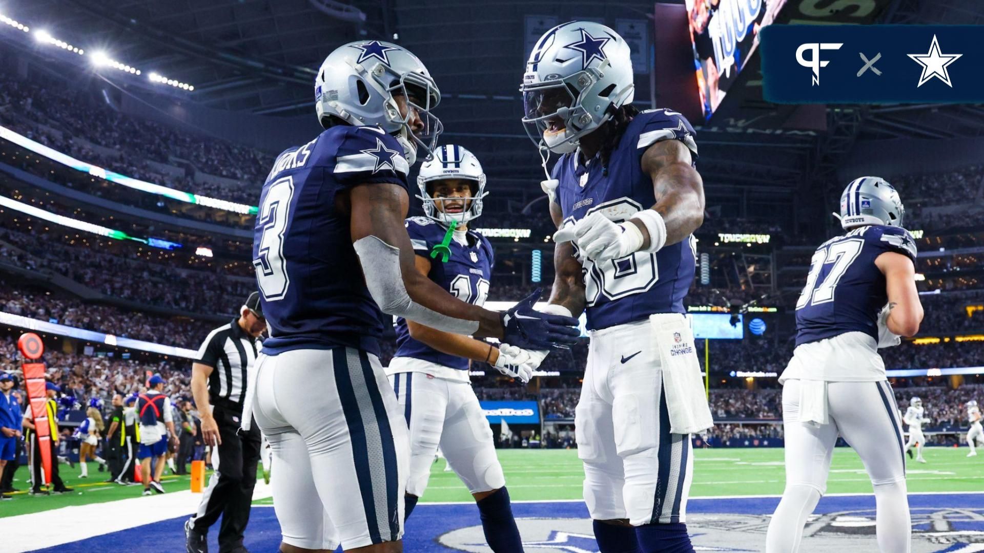 Dallas Cowboys wide receiver Brandin Cooks (3) celebrates with Dallas Cowboys wide receiver CeeDee Lamb (88) after making a touchdown catch during the second half against the Detroit Lions at AT&T Stadium.