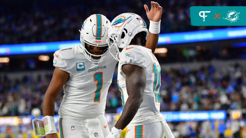 Miami Dolphins wide receiver Tyreek Hill (10) celebrates his touchdown scored against the Los Angeles Chargers with quarterback Tua Tagovailoa (1) during the first half at SoFi Stadium.