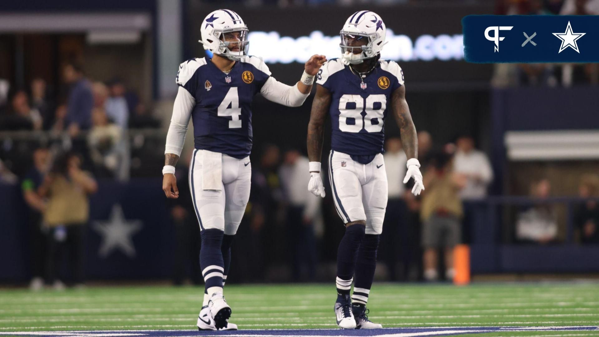 Dallas Cowboys wide receiver CeeDee Lamb (88) and quarterback Dak Prescott (4) talk during the game against the Washington Commanders at AT&T Stadium.