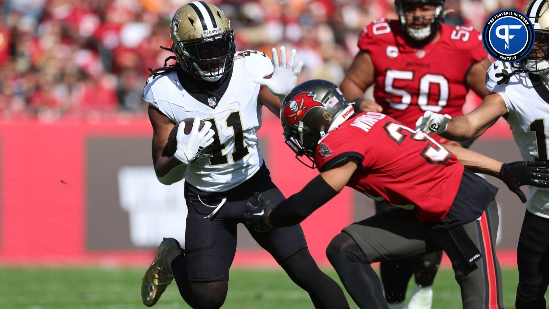 New Orleans Saints running back Alvin Kamara (41) stiff arms Tampa Bay Buccaneers safety Antoine Winfield Jr. (31) during the first quarter at Raymond James Stadium