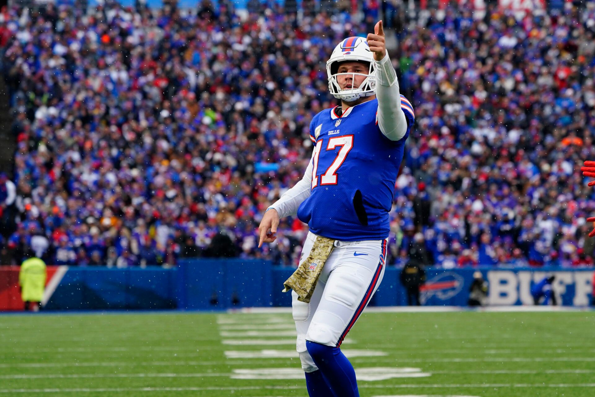 Buffalo Bills quarterback Josh Allen (17) reacts to running for a first down against the Minnesota Vikings during the first half at Highmark Stadium.