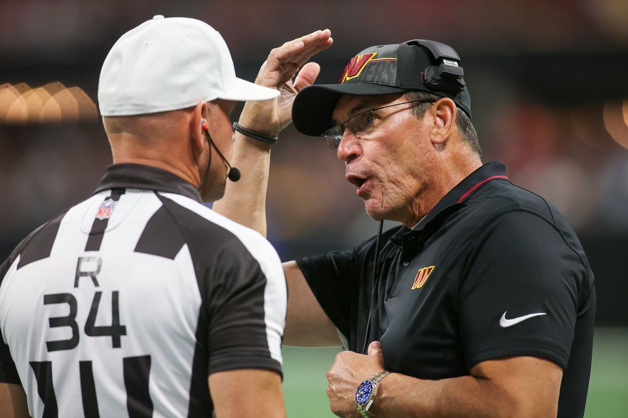 Washington Commanders head coach Ron Rivera talks to referee Clete Blakeman (34) against the Atlanta Falcons in the second half at Mercedes-Benz Stadium.