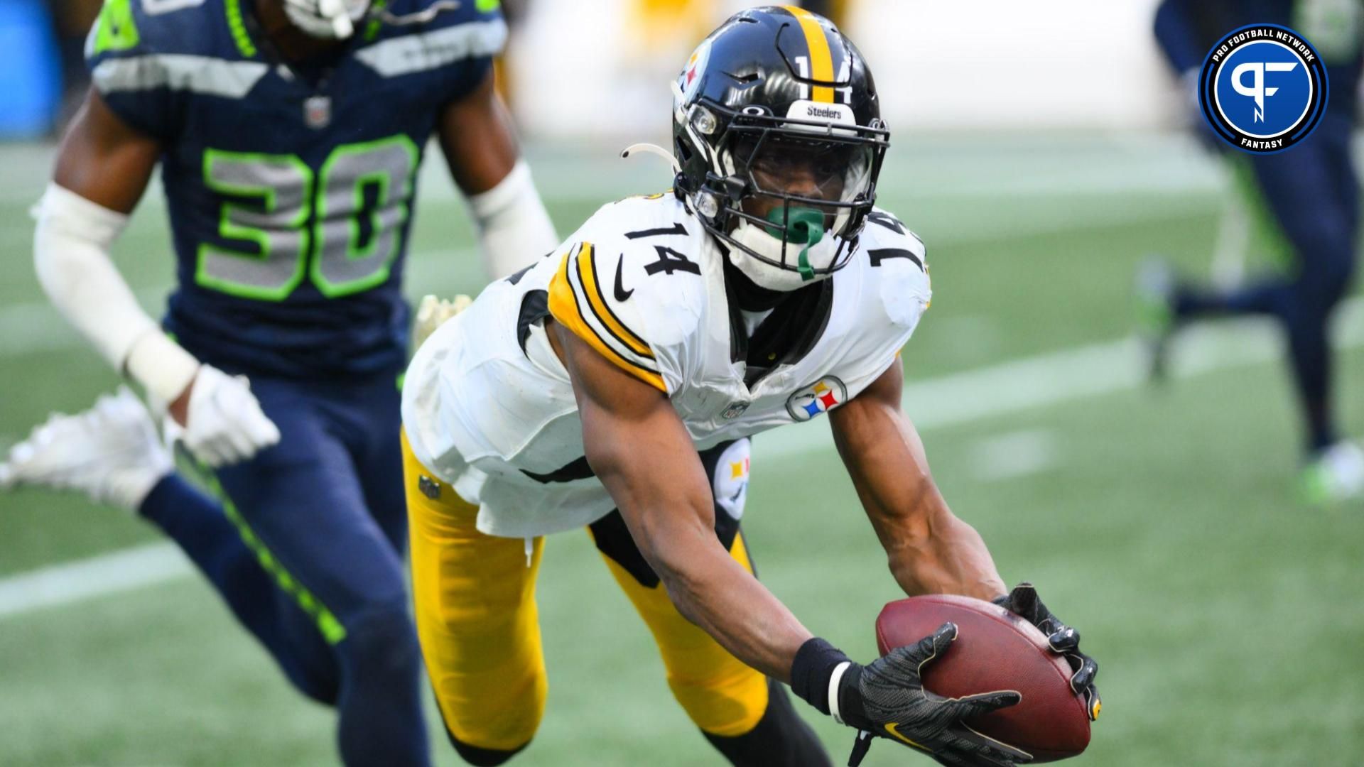 Pittsburgh Steelers wide receiver George Pickens (14) catches a pass against the Seattle Seahawks during the second half at Lumen Field.