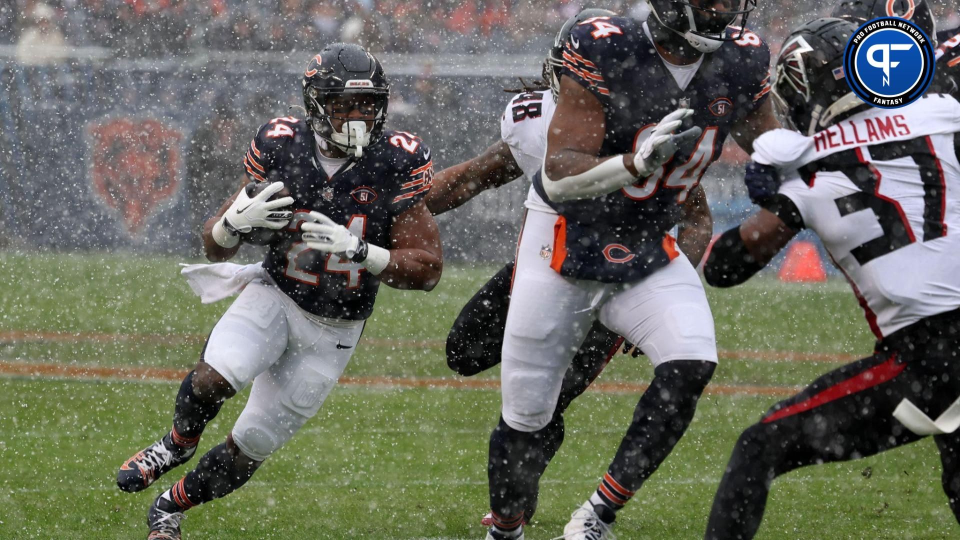 Chicago Bears running back Khalil Herbert (24) rushes the ball against the Atlanta Falcons during the first half at Soldier Field.