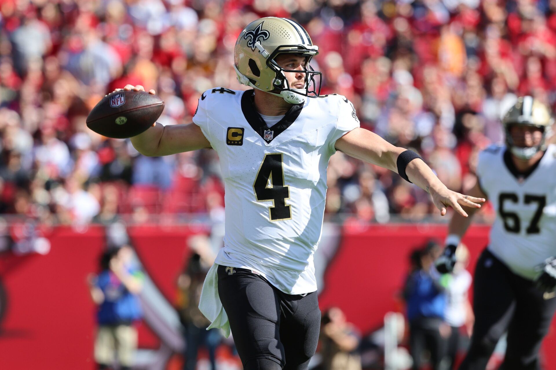 New Orleans Saints quarterback Derek Carr (4) throws the ball against the Tampa Bay Buccaneers during the first quarter at Raymond James Stadium.