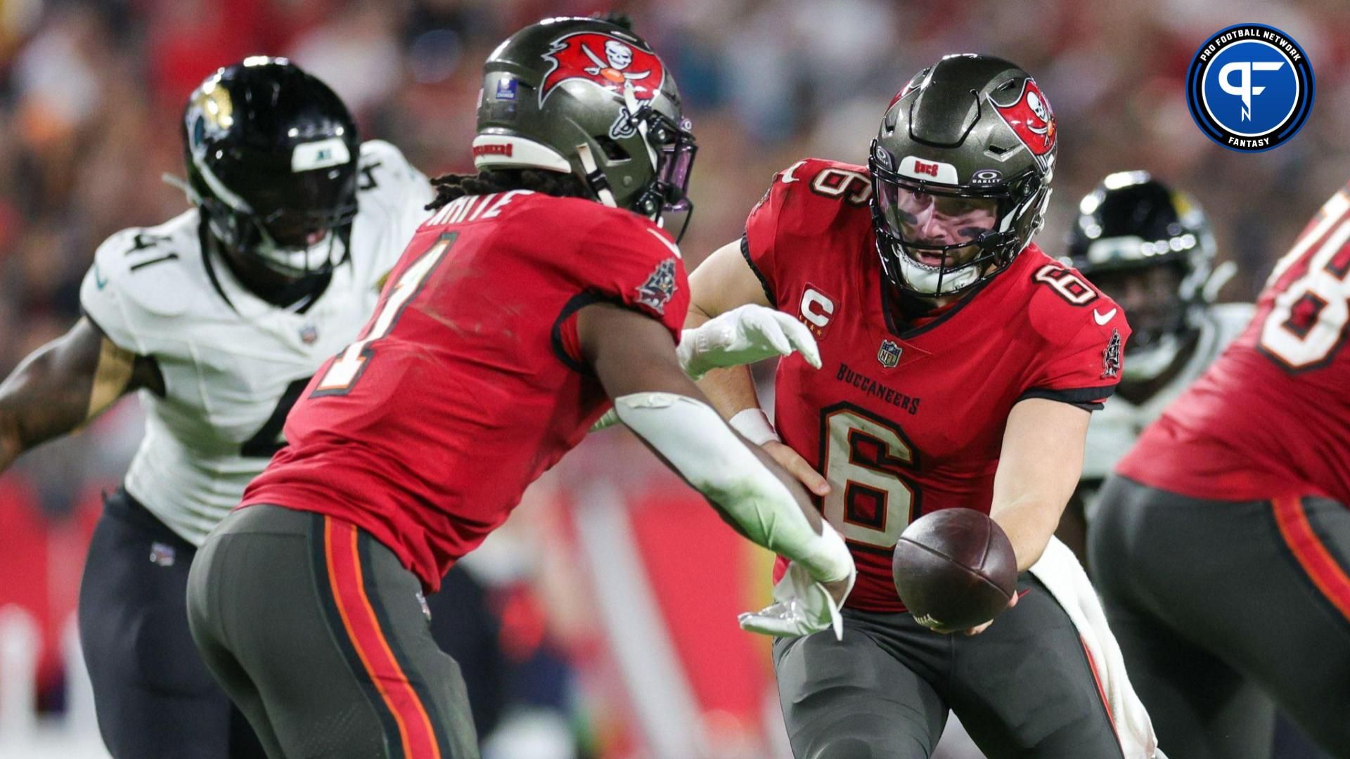 Tampa Bay Buccaneers quarterback Baker Mayfield (6) hands off to running back Rachaad White (1) against the Jacksonville Jaguars in the third quarter at Raymond James Stadium.