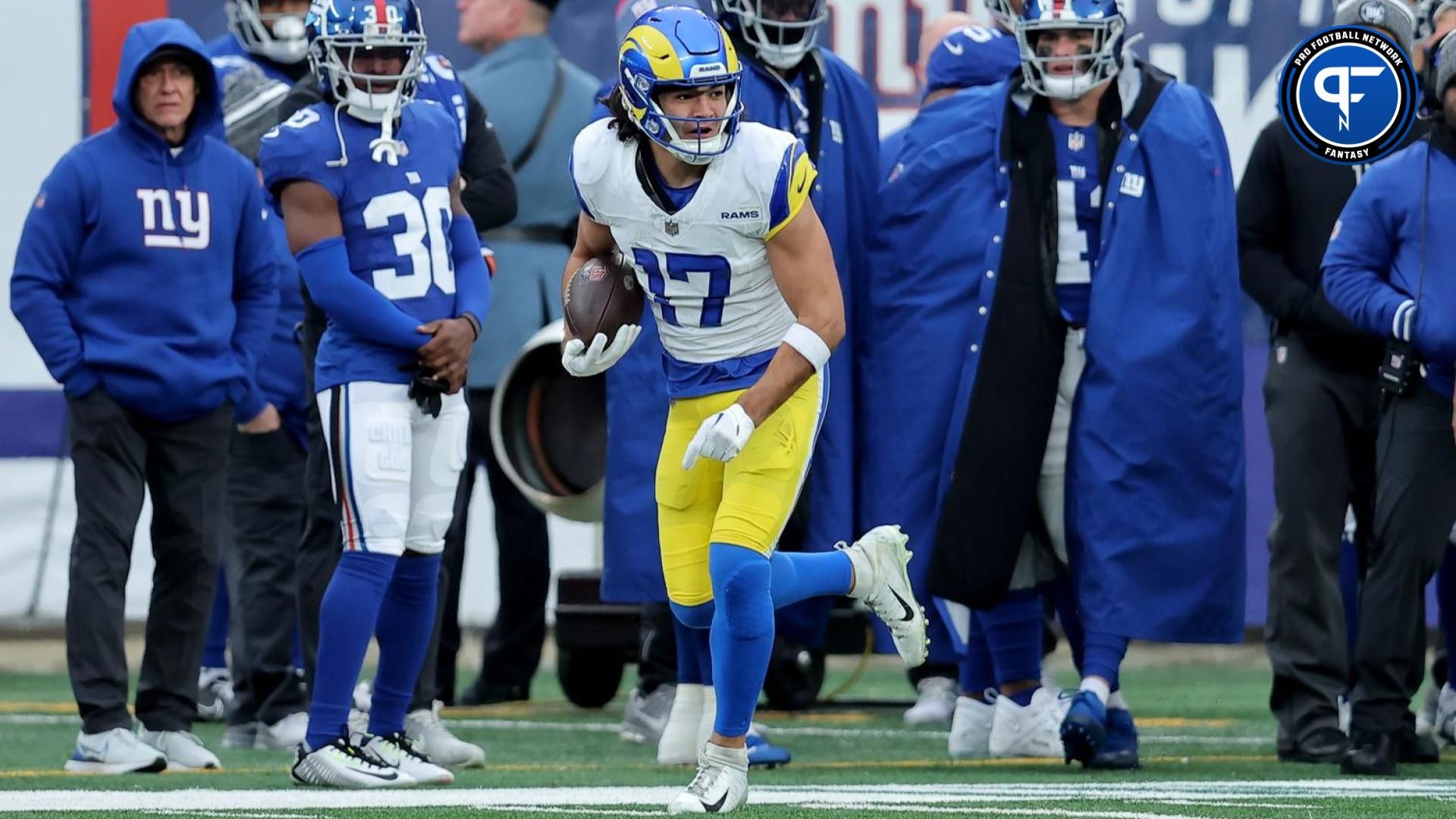 Los Angeles Rams wide receiver Puka Nacua (17) runs with the ball against the New York Giants during the third quarter at MetLife Stadium.