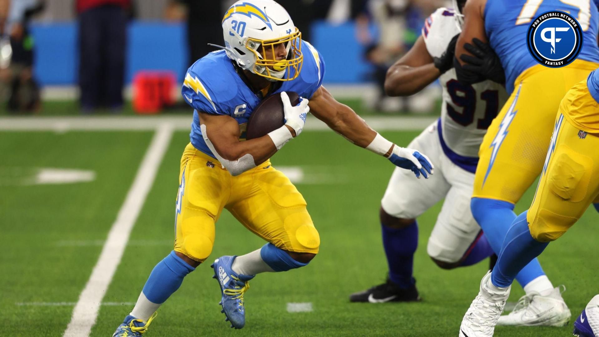 Los Angeles Chargers running back Austin Ekeler (30) runs with the ball during the first quarter against the Buffalo Bills at SoFi Stadium.