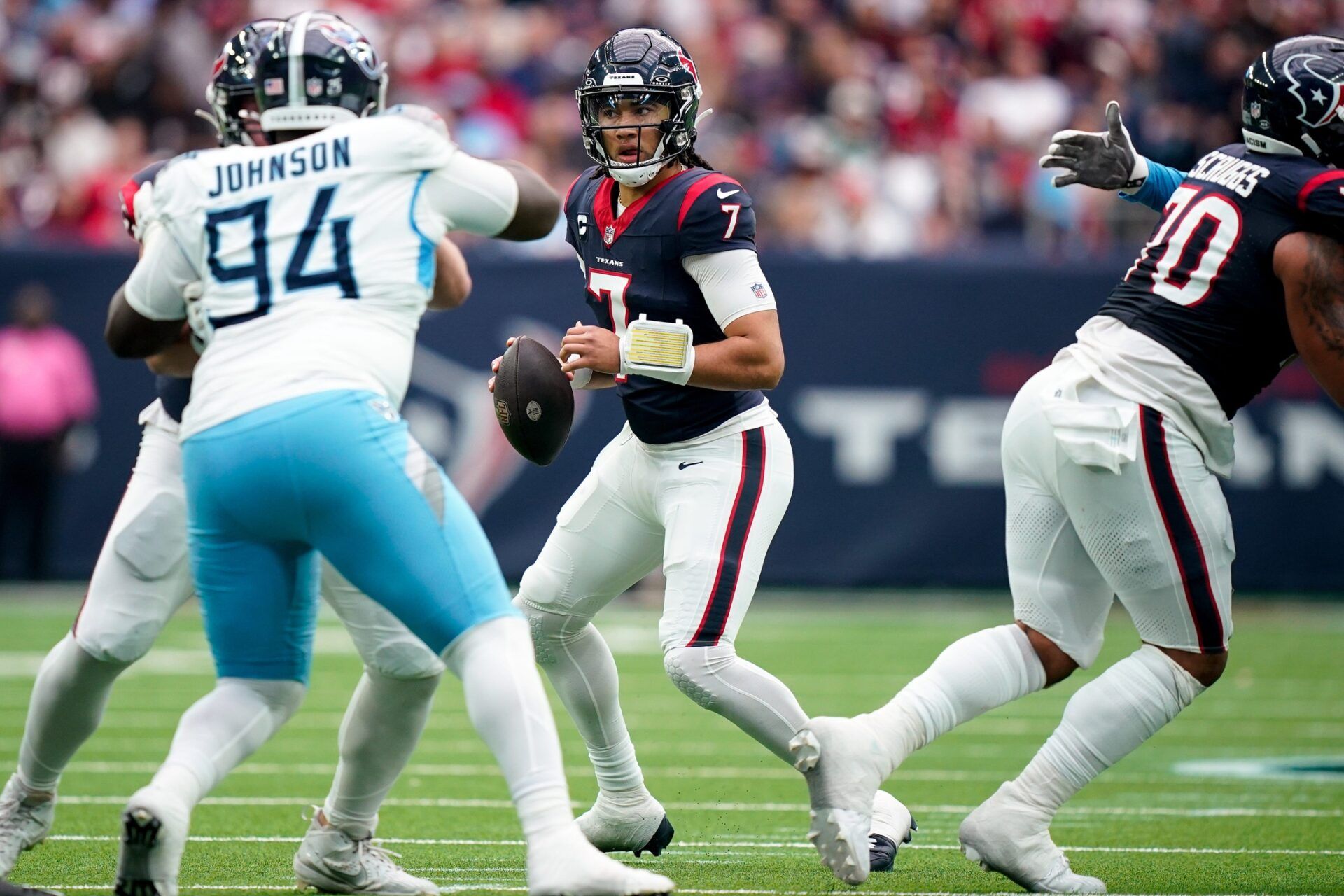 Houston Texans quarterback C.J. Stroud (7) looks for a receiver against the Tennessee Titans during the second quarter at NRG Stadium in Houston, Texas., Sunday, Dec. 31, 2023.