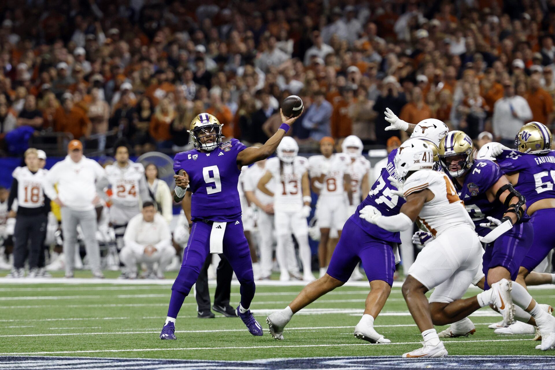 Washington Huskies quarterback Michael Penix Jr. (9) passes the ball against the Texas Longhorns during the second half of the 2024 Sugar Bowl college football playoff semifinal game at Caesars Superdome.