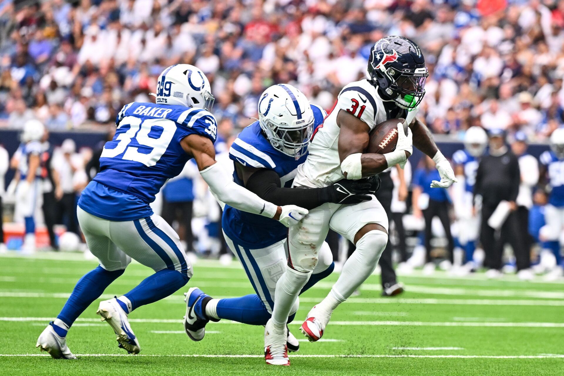 Houston Texans RB Dameon Pierce (31) is tackled by Indianapolis Colts players.