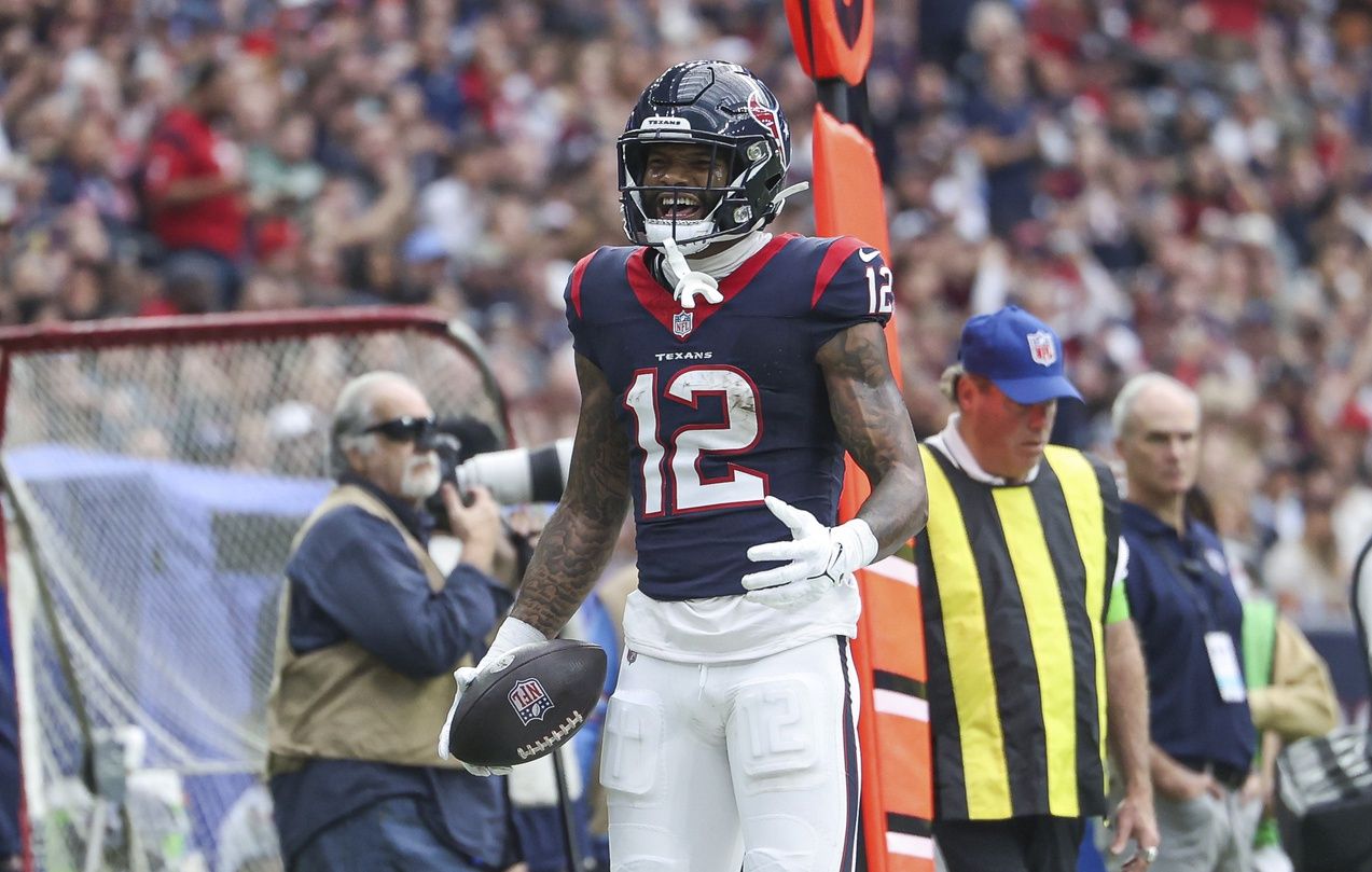 Houston Texans wide receiver Nico Collins (12) reacts after a reception during the second quarter against the Tennessee Titans at NRG Stadium.