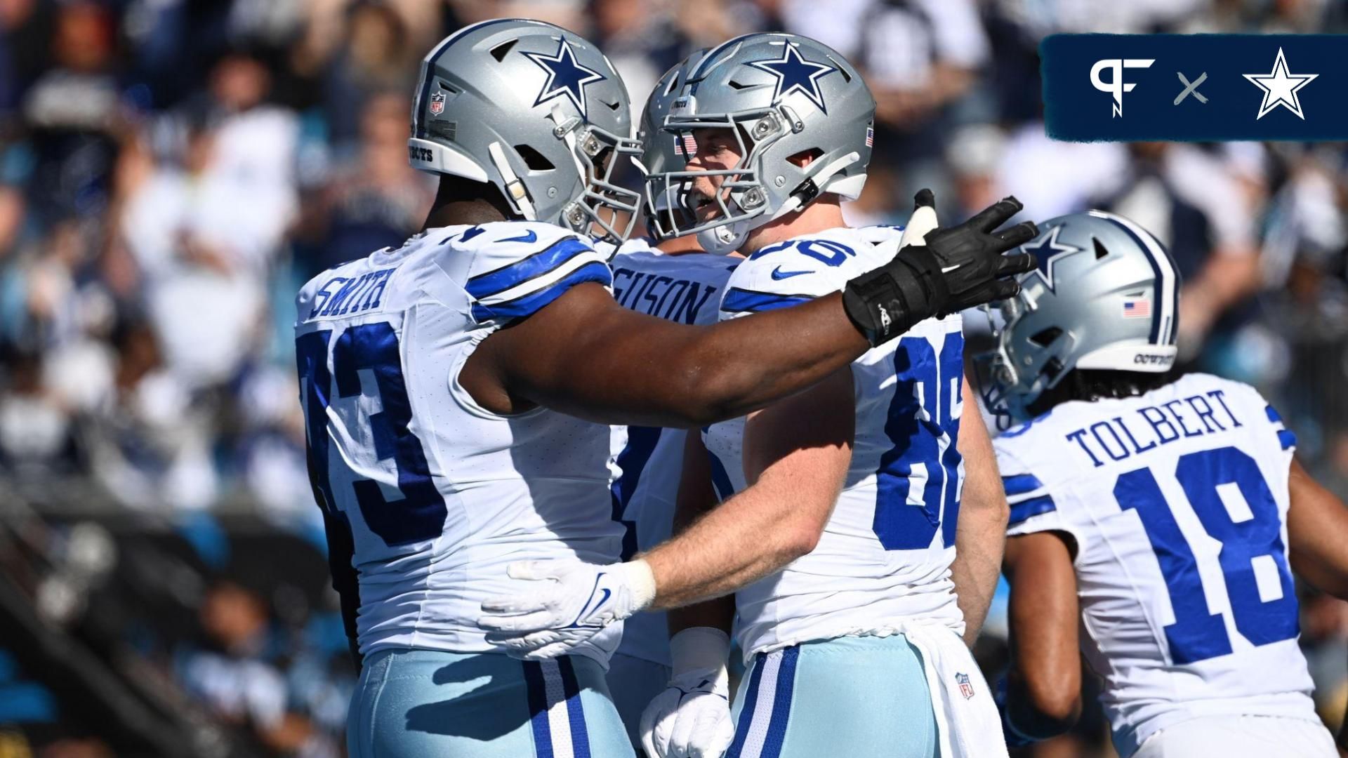 Dallas Cowboys tight end Luke Schoonmaker (86) celebrates with offensive tackle Tyler Smith (73) after scoring a touchdown in the first quarter at Bank of America Stadium.