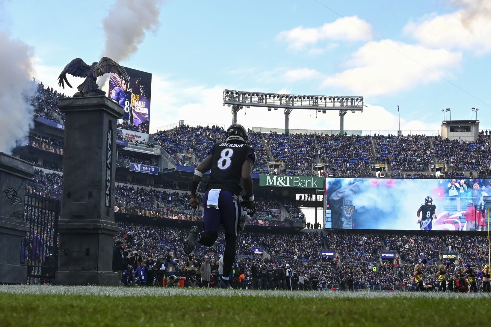 Lamar Jackson (8) enters the field before the game against the Miami Dolphins at M&T Bank Stadium.