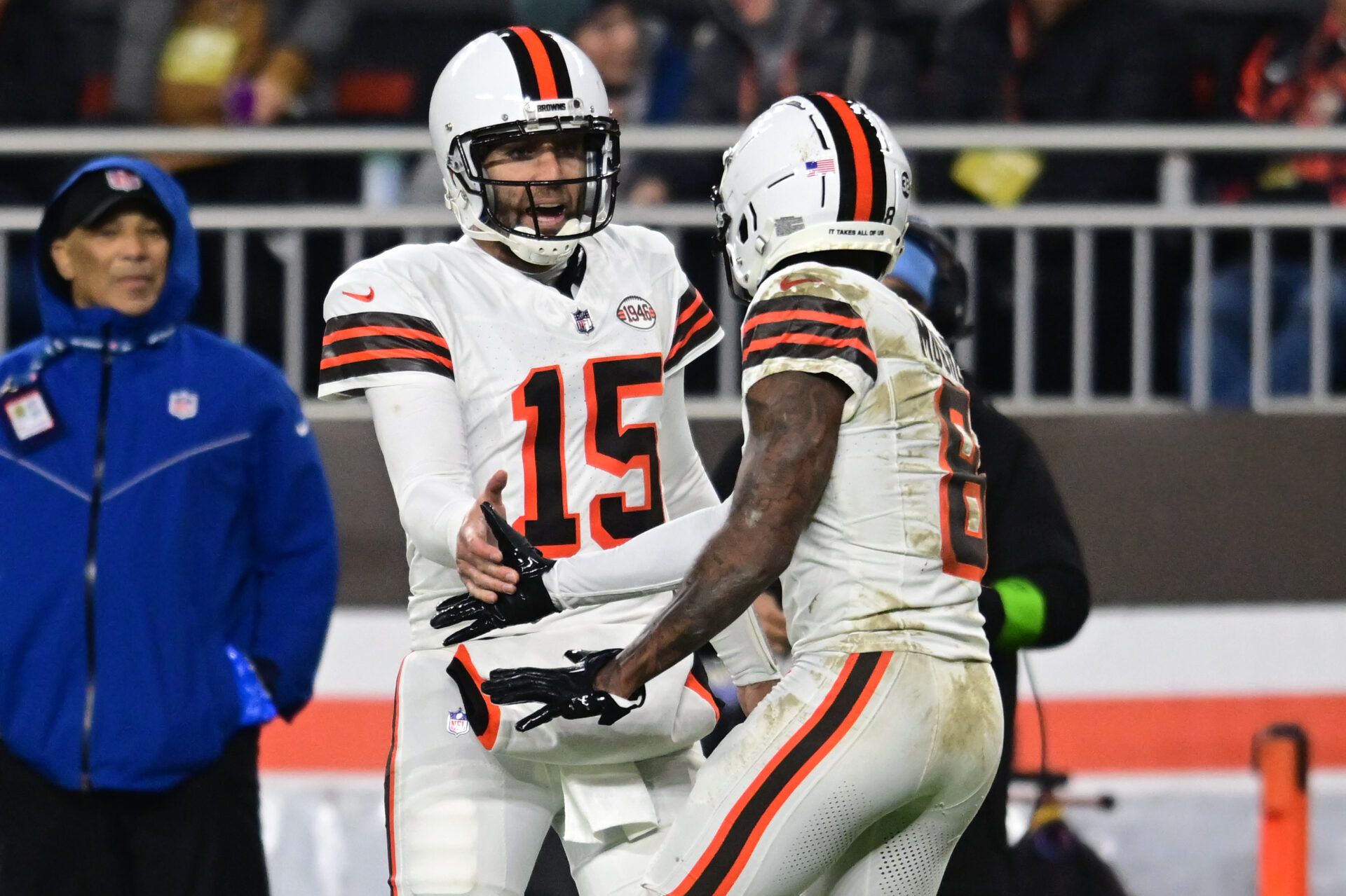 Cleveland Browns quarterback Joe Flacco (15) and wide receiver Elijah Moore (8) celebrate after a touchdown against the New York Jets during the first half at Cleveland Browns Stadium.