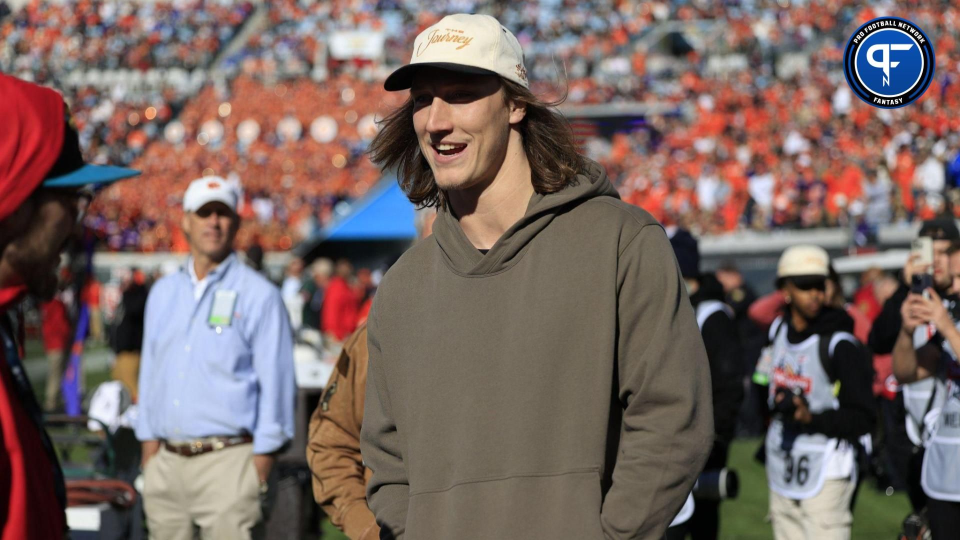 Jacksonville Jaguars quarterback Trevor Lawrence talks on the Clemson sideline during the third quarter of an NCAA football matchup