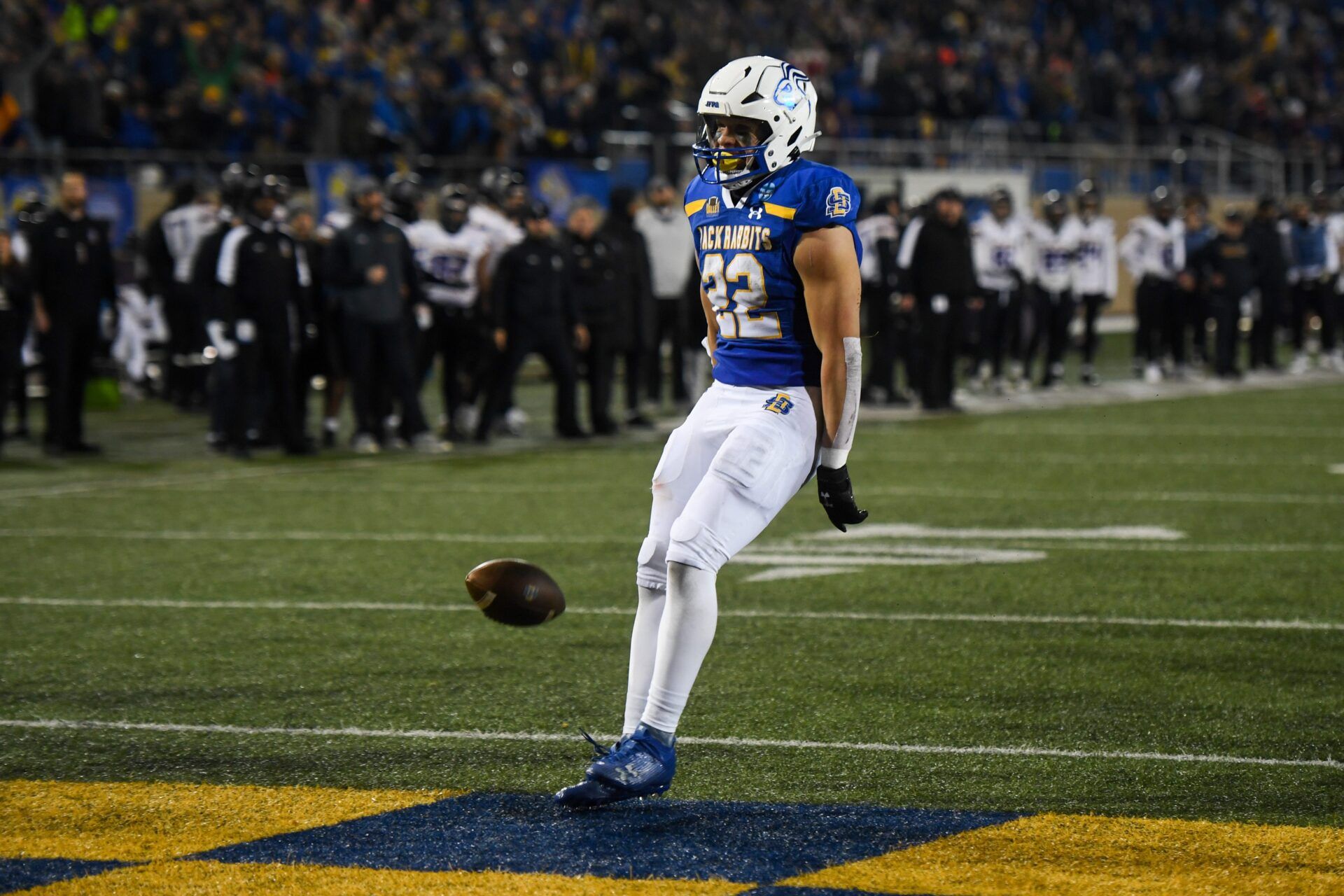 SDSU's running back Isaiah Davis (22) throws the ball on the ground after a touchdown.