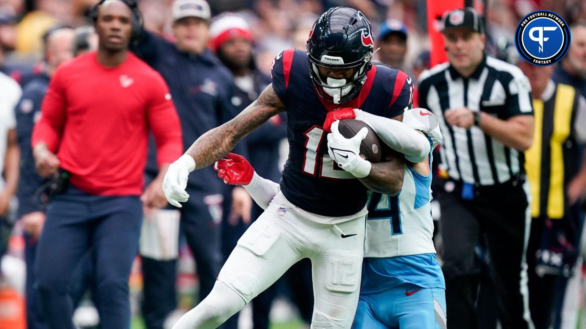 Houston Texans wide receiver Nico Collins (12) is stopped by Tennessee Titans cornerback Elijah Molden (24) during the third quarter at NRG Stadium