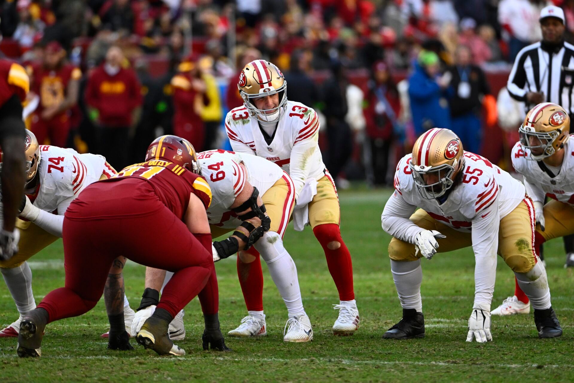 San Francisco 49ers quarterback Brock Purdy (13) at the line of scrimmage against the Washington Commanders during the second half at FedExField.