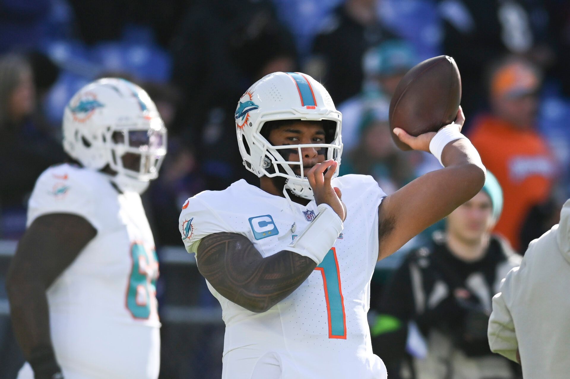 Miami Dolphins quarterback Tua Tagovailoa (1) throws on the field before the game against the Baltimore Ravens at M&T Bank Stadium.