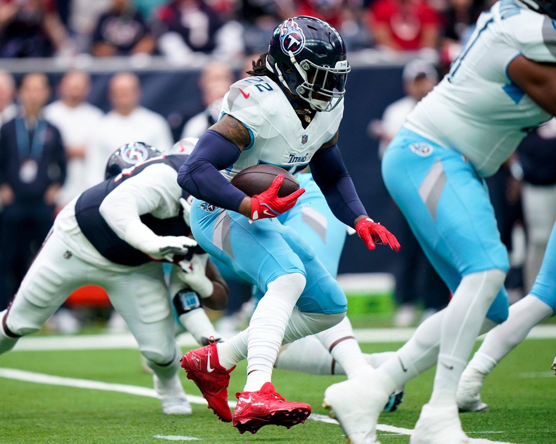 Tennessee Titans running back Derrick Henry (22) carries the ball against the Houston Texans during the first quarter at NRG Stadium