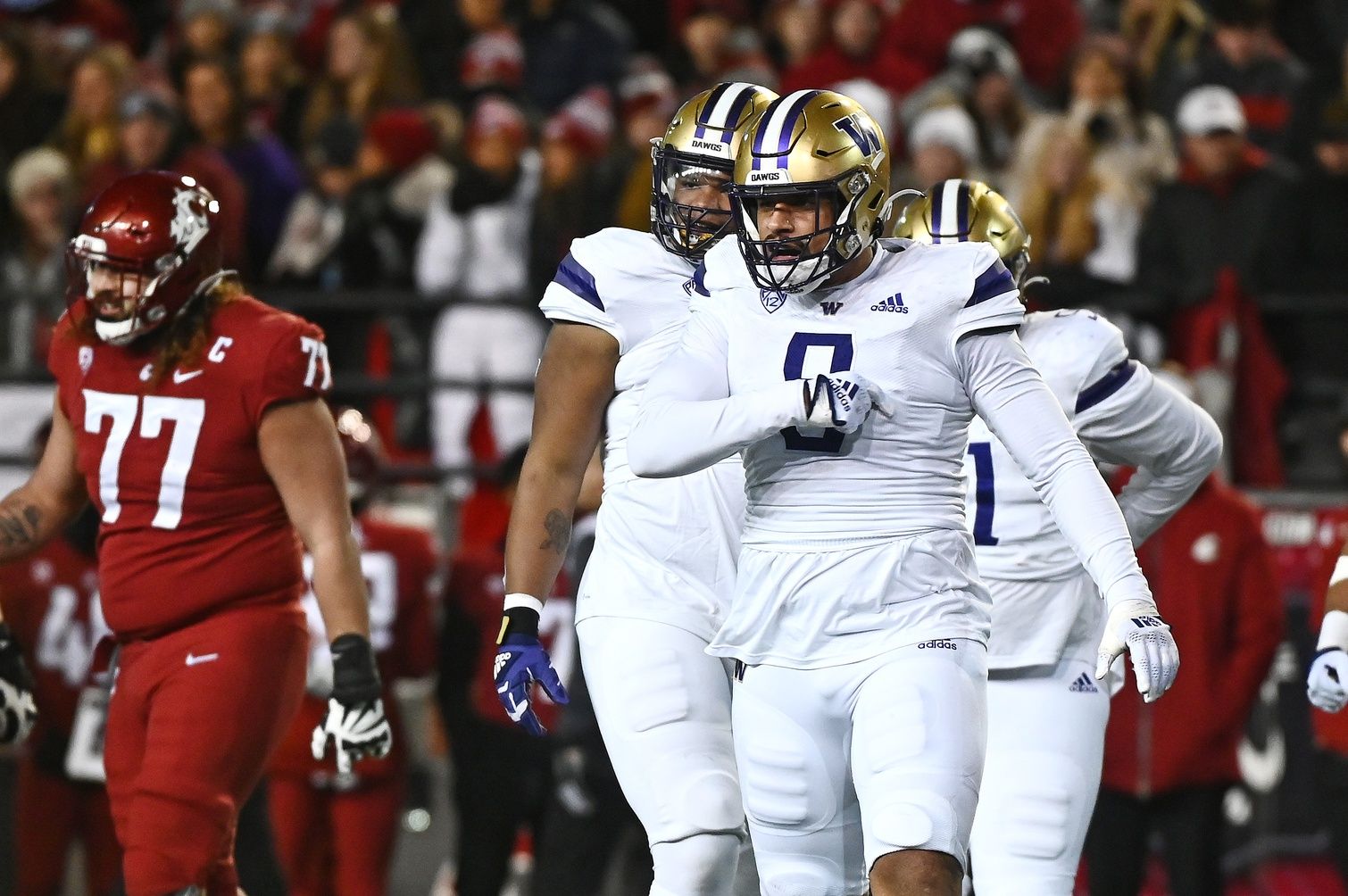 Washington Huskies defensive lineman Bralen Trice (8) celebrates after a play against the Washington State Cougars in first half at Gesa Field at Martin Stadium.