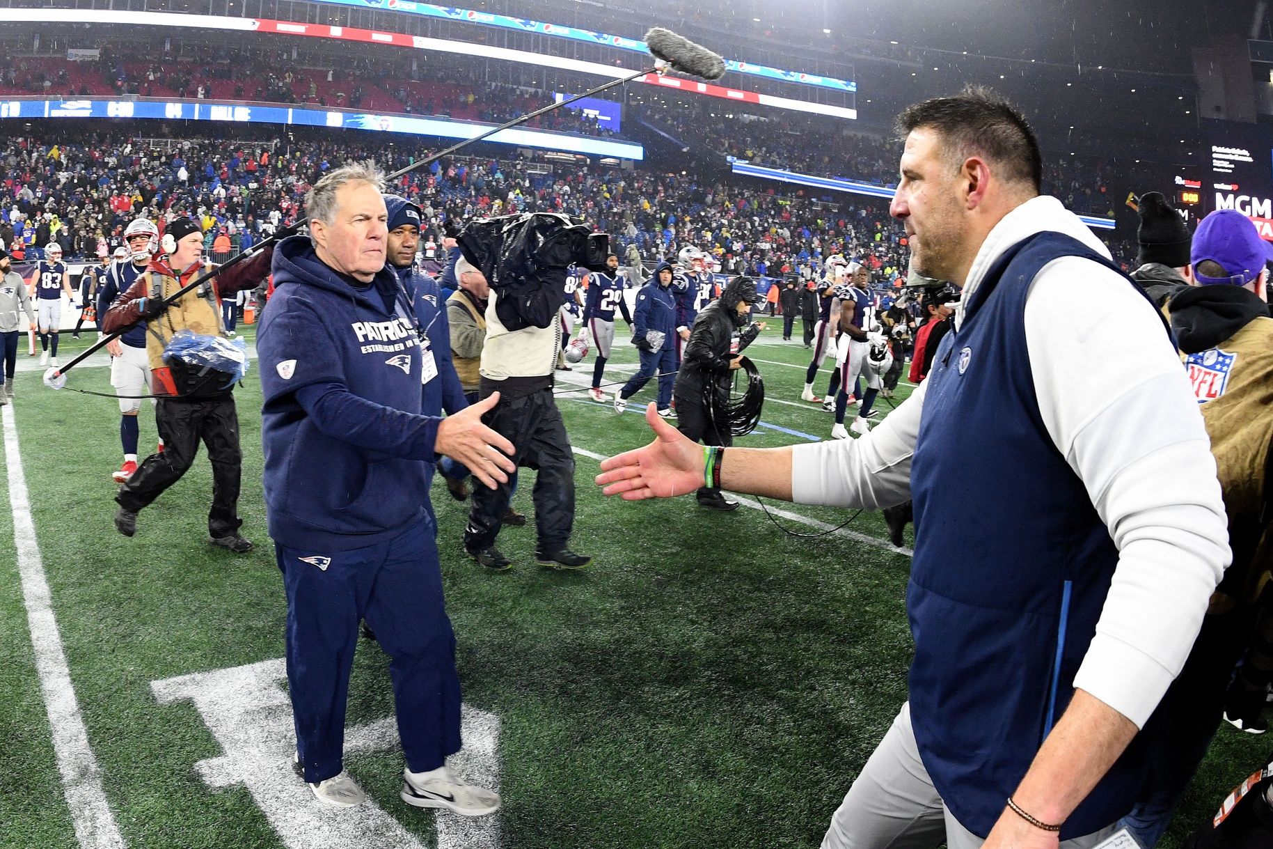 New England Patriots head coach Bill Belichick shakes hands with Tennessee Titans head coach Mike Vrabel after the Patriots lost to the Titans at Gillette Stadium.