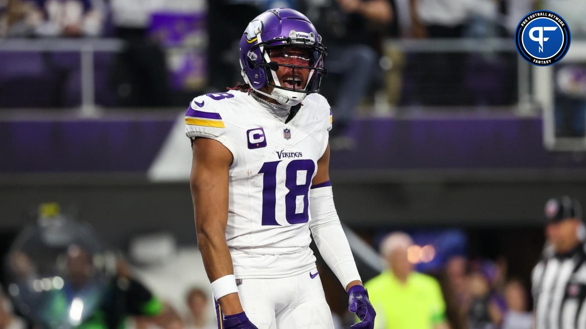 Minnesota Vikings wide receiver Justin Jefferson (18) celebrates wide receiver K.J. Osborn's (17) touchdown against the Detroit Lions during the third quarter at U.S. Bank Stadium.